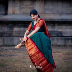 A cherished memory from a special photoshoot. This image captures a moment of dance against an ancient temple wall, blending the art form with its historic roots.