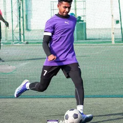 Experience the thrill of the game on our premium football turfs. This action shot from the Just Fives League captures a player in motion, highlighting the quality surface ideal for fast-paced 5-a-side football.