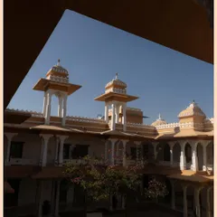 A beautifully framed shot of the Rajasthani palace architecture, showcasing the intricate design and warm colors of the venue.