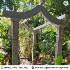 Our craftsmanship extends to traditional materials like stone. This custom built natural stone arch provides a beautiful, rustic entrance to a garden seating area, blending seamlessly with the surrounding nature.