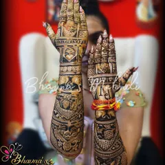 Here you can see the full bridal mehndi, with both hands held up to show the complete design. The artwork is dense and rich, covering the arms with traditional figures and patterns, perfect for the bride who wants a classic look.