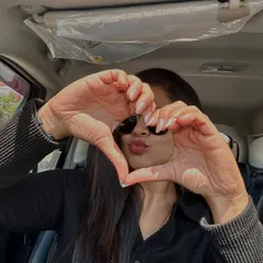 The heart hands pose says it all. This client is loving her clean and classic manicure, a simple yet beautiful statement.