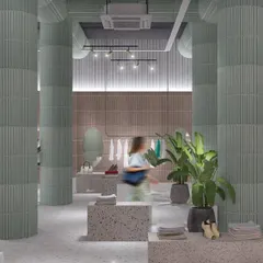 The open-plan layout of the GRASSROOT retail space. We focused on creating generous circulation paths and varied display heights to encourage a relaxed browsing experience where the architecture supports the sale.
