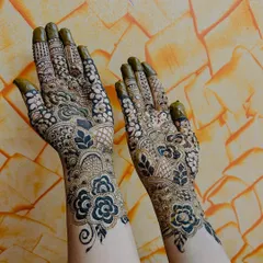A full bridal henna design, packed with detail. I love creating these dense, traditional patterns that cover the hands and wrists, making sure every part of the design is sharp and meaningful for the bride's big day.