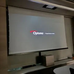The system powering on, displaying the Optoma logo. We ensure every component, from the projector to the screen, is perfectly calibrated for optimal performance right from the start.