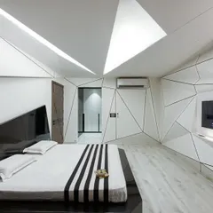 We pushed the boundaries of bedroom design with this deconstructivist concept. The interplay of geometric lines on the walls and ceiling creates a dynamic, sculptural space, while the monochrome palette maintains a sense of sophisticated calm.