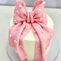 Why stop at wrapping the gift when the cake can come wrapped too? This elegant bow cake is ideal for bridal showers, birthdays, or any special moment.