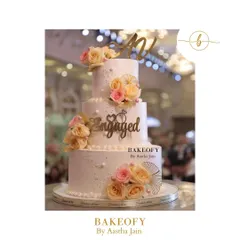 A stunning peach-themed engagement cake, all made with fresh fruits. The couple wanted something elegant, so I used fresh roses in contrasting pink and peach hues to create this beautiful floral cascade.