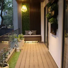 A complete project journey. From a cluttered, unused space (6), we created a stylish and functional long balcony (5, 8). The design features low-maintenance wooden decking, a cozy swing chair, and a dedicated seating nook with a vertical garden backdrop, completely transforming the vibe.
