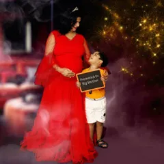 A creative maternity portrait announcing the arrival of a new family member. The 'Promoted to Big Brother' sign adds a fun and personal touch.