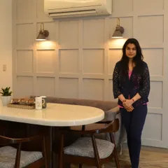 Here I am in a home we designed for a young couple. The theme was a simple and elegant gray base with pops of blue and yellow. Creating comfortable and beautiful homes for families is one of the most rewarding parts of my work.