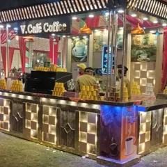 A different angle of the mobile coffee bar, showcasing the checkered light-up counter and the organized stacks of cups. My staff ensures service is always quick, professional, and friendly.