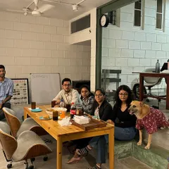 A candid moment during a team meeting at the studio. Brainstorming and sharing ideas in a relaxed environment is central to our creative process.