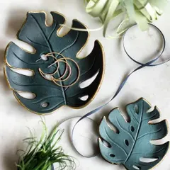 My handmade clay keepsakes are a core part of what makes my gift boxes unique. These monstera leaf trinket dishes are sculpted and painted by hand, with gold-leaf accents for a touch of elegance. They are perfect for holding jewelry and small accessories, adding a piece of sustainable art to your home.