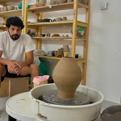 Pradyumna has been with us for just over a year, and he already creates with such passion. Here he is with one of his beautifully thrown forms, ready for the next stage of decoration.