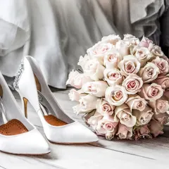 "Already feeling Wifey." A classic shot of the bridal essentials: elegant Ted Baker heels and a beautiful bouquet of roses, ready for the big day.