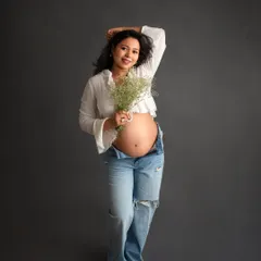 A playful and happy shot that shows off this mom-to-be's joyful personality. The casual styling feels so authentic and real.
