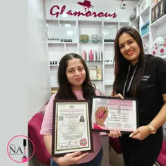 Celebrating a student's successful completion of her nail art training. She holds both her institute certificate and the official government-recognized certificate.