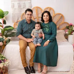 A full family portrait showcasing our boho theme. The combination of natural textures, plants, and flowers creates a warm and inviting atmosphere.