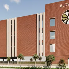 A detail rendering of the industrial fan manufacturing unit. The prominent circular motif, echoing the company's product, is integrated into a facade that uses vertical louvers and brickwork to achieve its green certification goals.