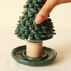 My Coniferous Christmas tree candle holder is designed to be multifunctional. You can place a candle inside for a warm glow or use it as an incense burner.
