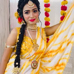 A Haldi look should be bright, fresh, and fun. Here, I've used a pop of colour on the lips and kept the base dewy to match the vibrant yellow outfit and floral jewellery, making sure the bride glows.