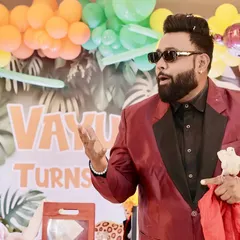 Engaging with the audience is key. Here, I am in the middle of a classic dove trick at a jungle-themed birthday party for a young boy named Vayu.