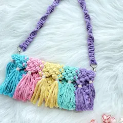 For those who love color, this rainbow tassel bag is pure joy. Each tassel is a different pastel shade, creating a fun, eye-catching accessory that's sure to make you smile.