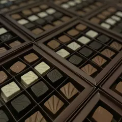 Different flavors for every mood. A large batch of our nine-piece assorted truffle boxes, showcasing the variety we can provide for corporate and bulk orders.