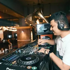 Even when I'm focused on the mix, I'm always feeling the party's vibe. A great DJ set is a balance of technical skill and pure fun. Here I am at Mitron, spinning a mix of Bollywood and hip hop to keep the night alive.