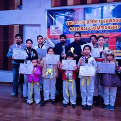 Our team proudly displays their medals and certificates after competing in the 2nd Delhi Open Taekwondo National Championship.