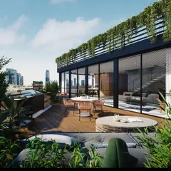 A view of a completed rooftop terrace project, integrating a glass-walled sunroom with an open deck and lush greenery. This design creates a true urban oasis, blending modern architecture with natural elements high above the city.