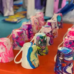 Every child leaves the party with their own unique creation. These beautiful marbled mugs are a super popular take-home craft, made by the kids themselves during the party. It's a wonderful, lasting memory of a fun-filled day.