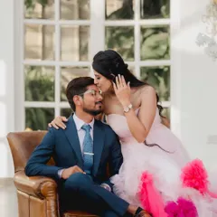 A tender moment captured in a beautiful indoor setting. The groom's adoring kiss on the forehead and the bride's stunning gown make this a classic romantic portrait from their Picture Villa shoot.