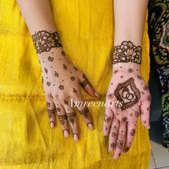 A chic and modern engagement design. It features delicate cuffs, scattered dots, and a bold centerpiece with intertwined rings.