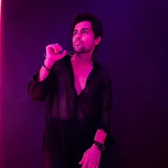 All black, all confident. A shot from a moody and stylish photoshoot, playing with lights and shadows.