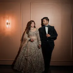 Glitz, glam, and a dash of magic for this stunning reception look. The makeup is fun and fierce, with shimmering highlights, nude lips, and a sparkle that lights up the night. This couple portrait is absolutely regal.