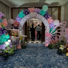 The entrance to the ONEderland party was a beautiful archway decorated with pastel balloons and flanked by large butterfly wing props.
