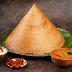 Capturing the impressive scale and perfect texture of this cone dosa was a fantastic challenge. We style traditional dishes to look authentic yet premium for high-end restaurant menus and delivery apps.