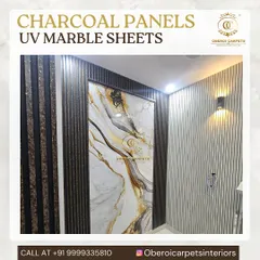A close-up of a UV marble sheet with dramatic gold and black veining, framed by charcoal panels. This combination creates a very modern and opulent look, perfect for an entryway or behind a TV.