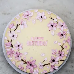 My artistic creations are not just for cakes. This creamy baked cheesecake is decorated with delicate, hand-painted cherry blossoms. It’s a beautiful and delicious alternative for someone who wants a truly unique design.