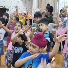 Look at them go. This group of enthusiastic campers is fully engaged in a high-energy dance number, learning new steps and coordinating their moves as a team.