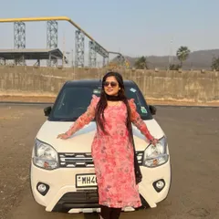 My client posing in her custom floral organza kurta. It's a versatile piece that can be dressed up or down for any casual occasion.