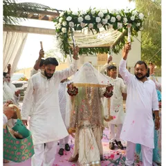 The bride's entry under a 'phoolon ki chadar' is a timeless and emotional moment. We design beautiful floral canopies that make this walk even more special.