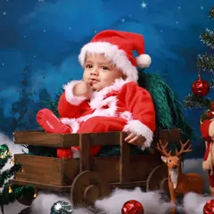 Another adorable moment from the Christmas photoshoot, as this little Santa contemplates the magic of the season. I aim to capture a variety of poses and expressions during each session.