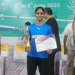 Our athlete, Dhanya Manjunatha, proudly holding her trophy after the state-ranking badminton tournament. Her dedication in our clinic paid off on the court.