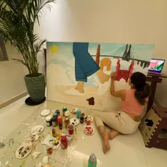 This is my therapy. A quiet space, a large canvas, and my paints. This photo captures me working on the Birkenstock canvas, lost in the process.