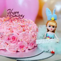 A pretty pink rosette cake next to a doll topper for Amaira's birthday. I focus on the little details that make your child's celebration unique.