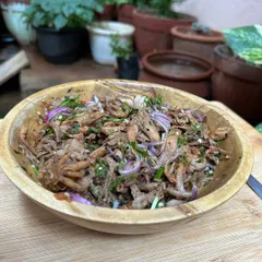 A fresh and delicious oyster mushroom chutney with roasted chillies, tomatoes, chopped onions, and chives.