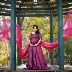 A beautiful shot of our purple flying gown, perfect for adding a touch of elegance and drama to your maternity or pre-wedding photoshoot.